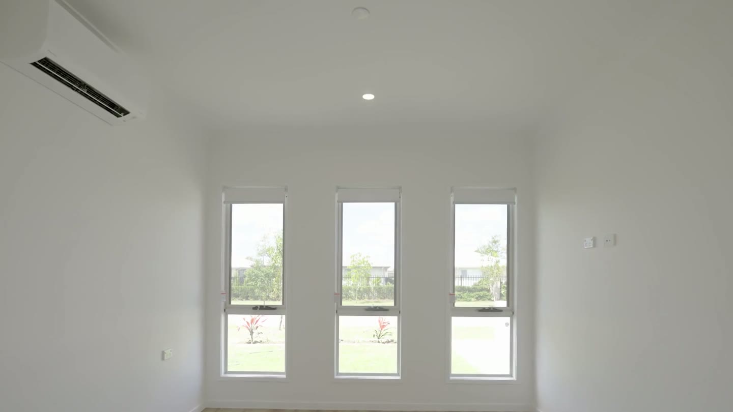 Overnight assistance bedroom with three tall windows